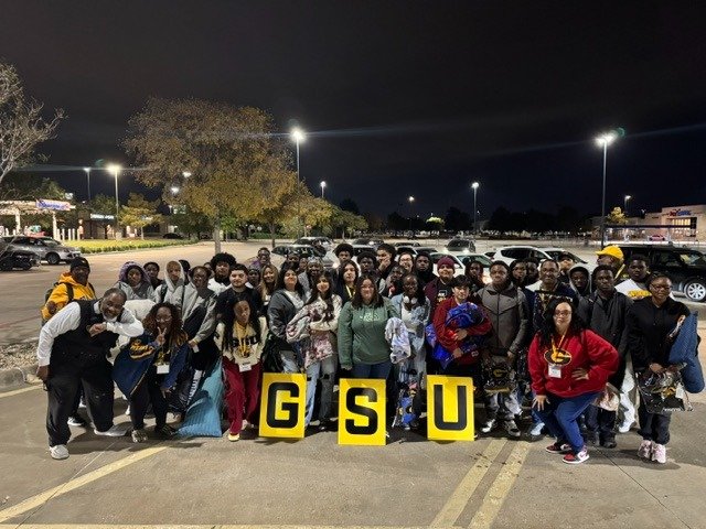 Chapter members at the Day At The Races Scholarship Gala presenting a donation check
